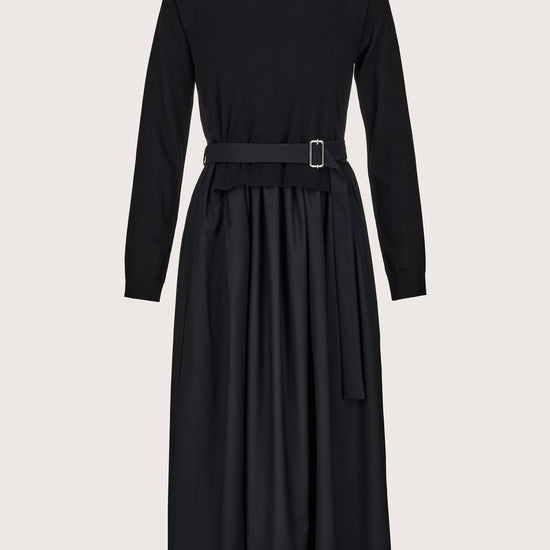 black jumper dress with pleated skirt and different fabric on the skirt and rear 