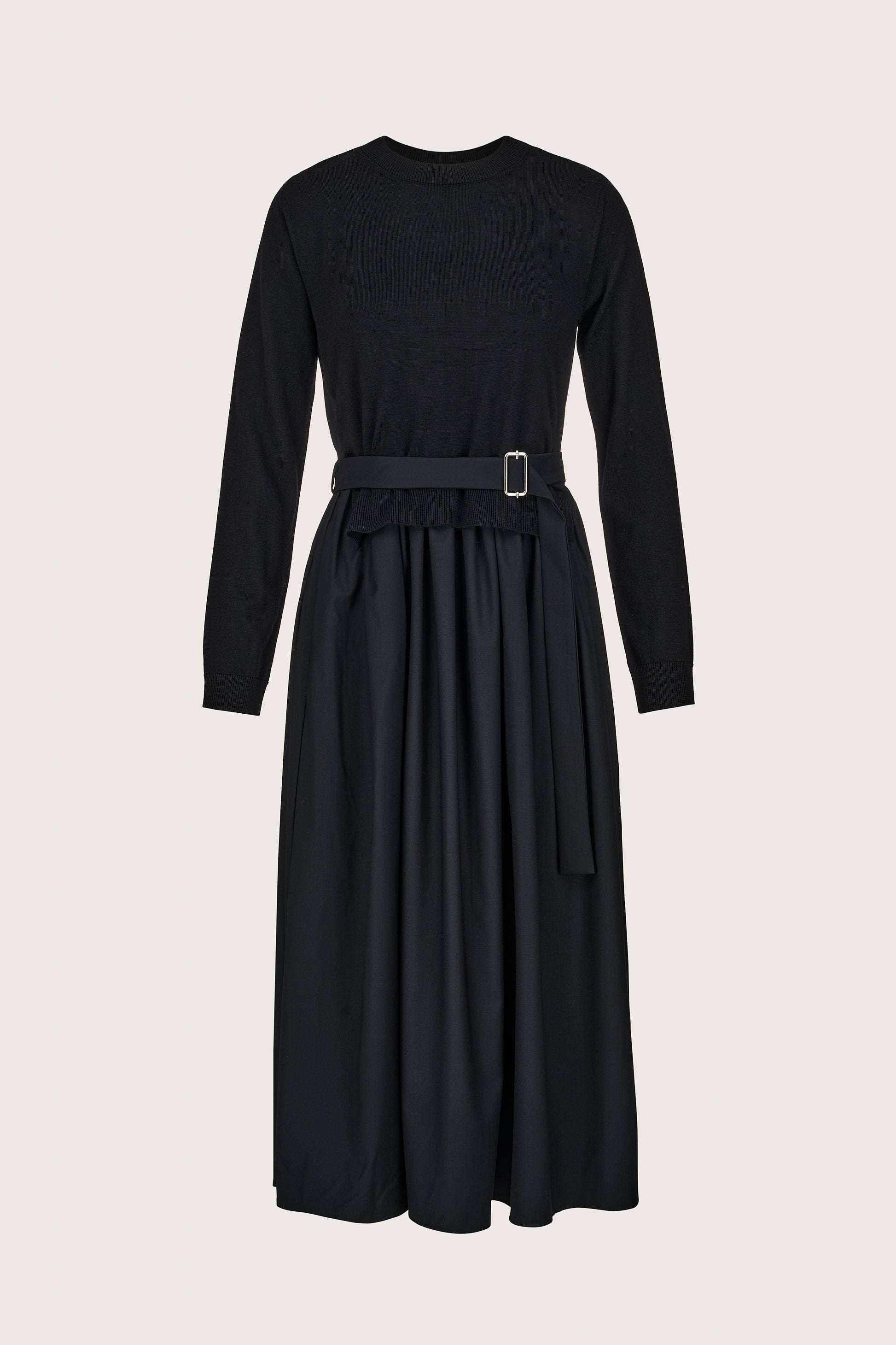 black jumper dress with pleated skirt and different fabric on the skirt and rear 