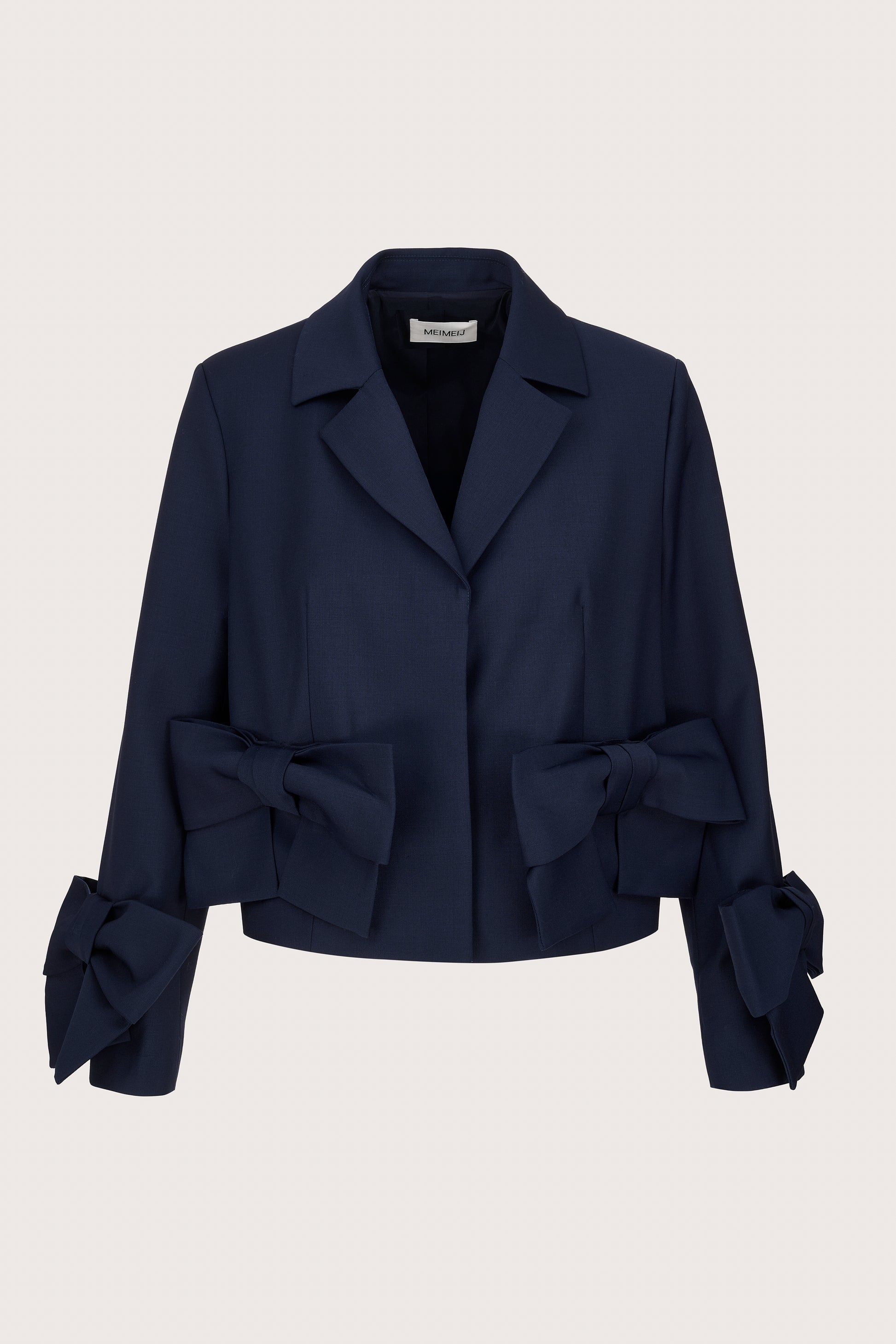 navy cropped blazer with 2 bows on the front and cuffs