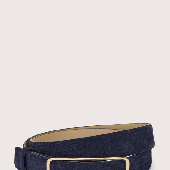 Navy belt with a gold buckle on a light gray background