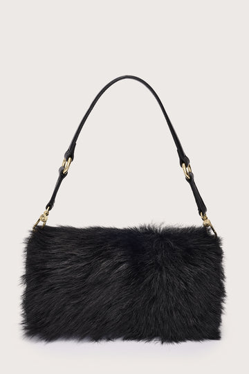 Black fur handbag with gold accents on a light gray background
