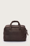 Brown leather bag on a light beige background