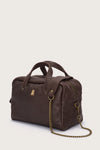 Brown leather bag with a chain detail on a light beige background