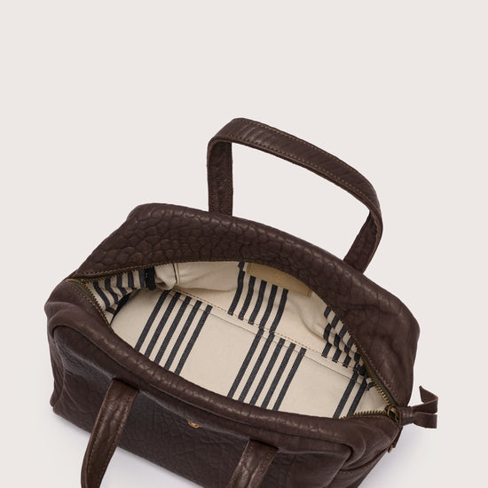 Brown bag with a striped interior on a white background