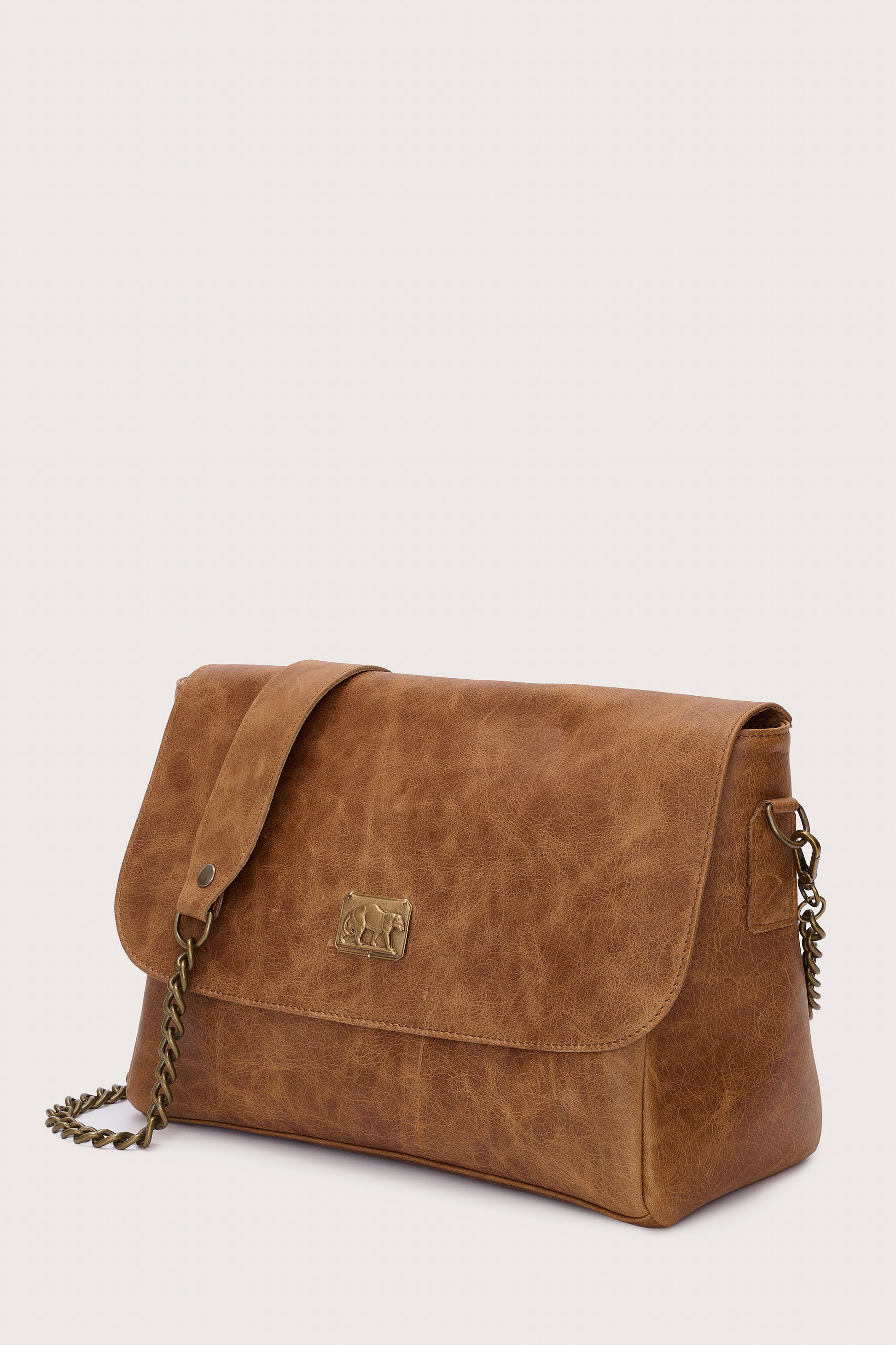 caramel leather flap bag with chain strap and panther stamp side view