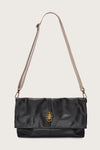 black leather fold over bag with gold scarab stamp and linen strap