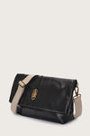 black leather fold over bag with gold scarab stamp and linen strap side view