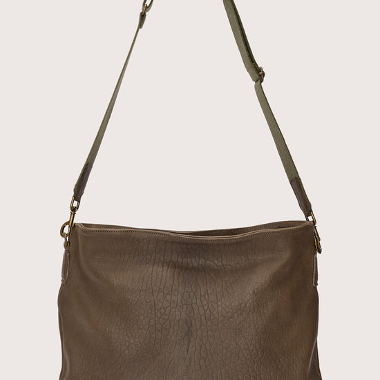 khaki green leather bag with khaki green linen strap and metal stamp detailing rear view