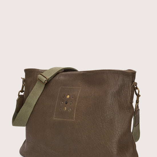 khaki green leather bag with khaki green linen strap and metal stamp detailing side view
