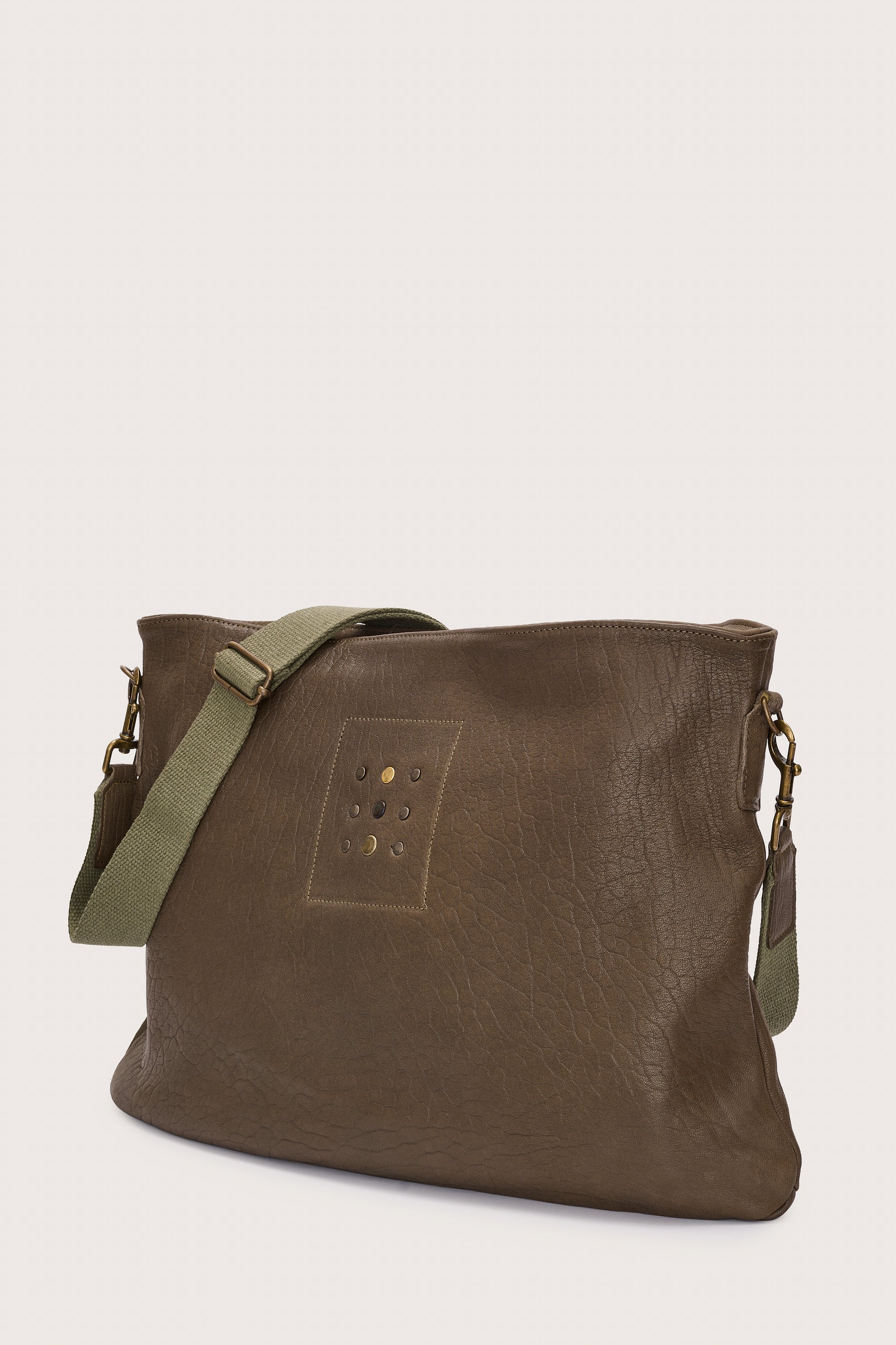 khaki green leather bag with khaki green linen strap and metal stamp detailing side view