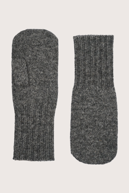 Pair of gray cashmere mittens on a light beige background friom absolute cashmere