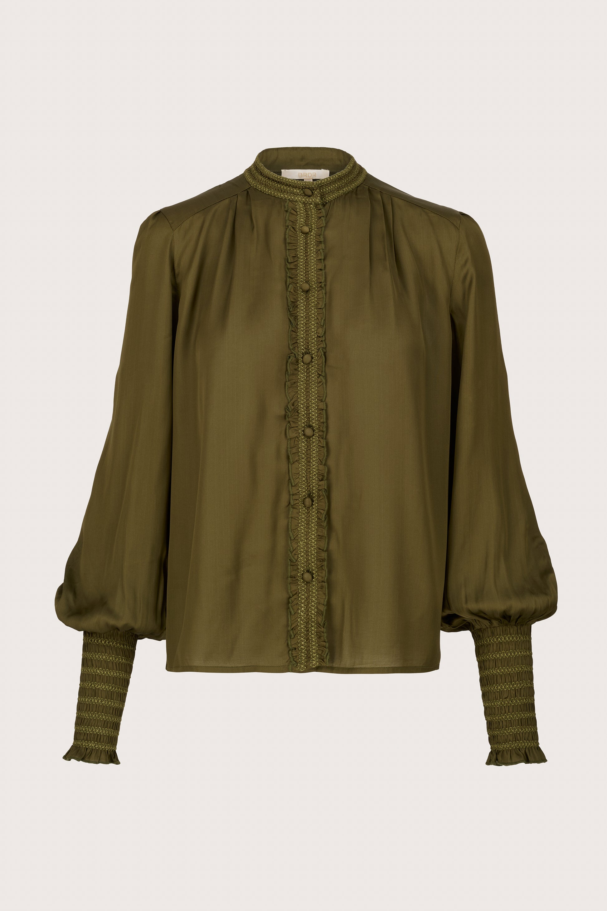 green round neck shirt with ruffle detailing and slim cuffs form brdr