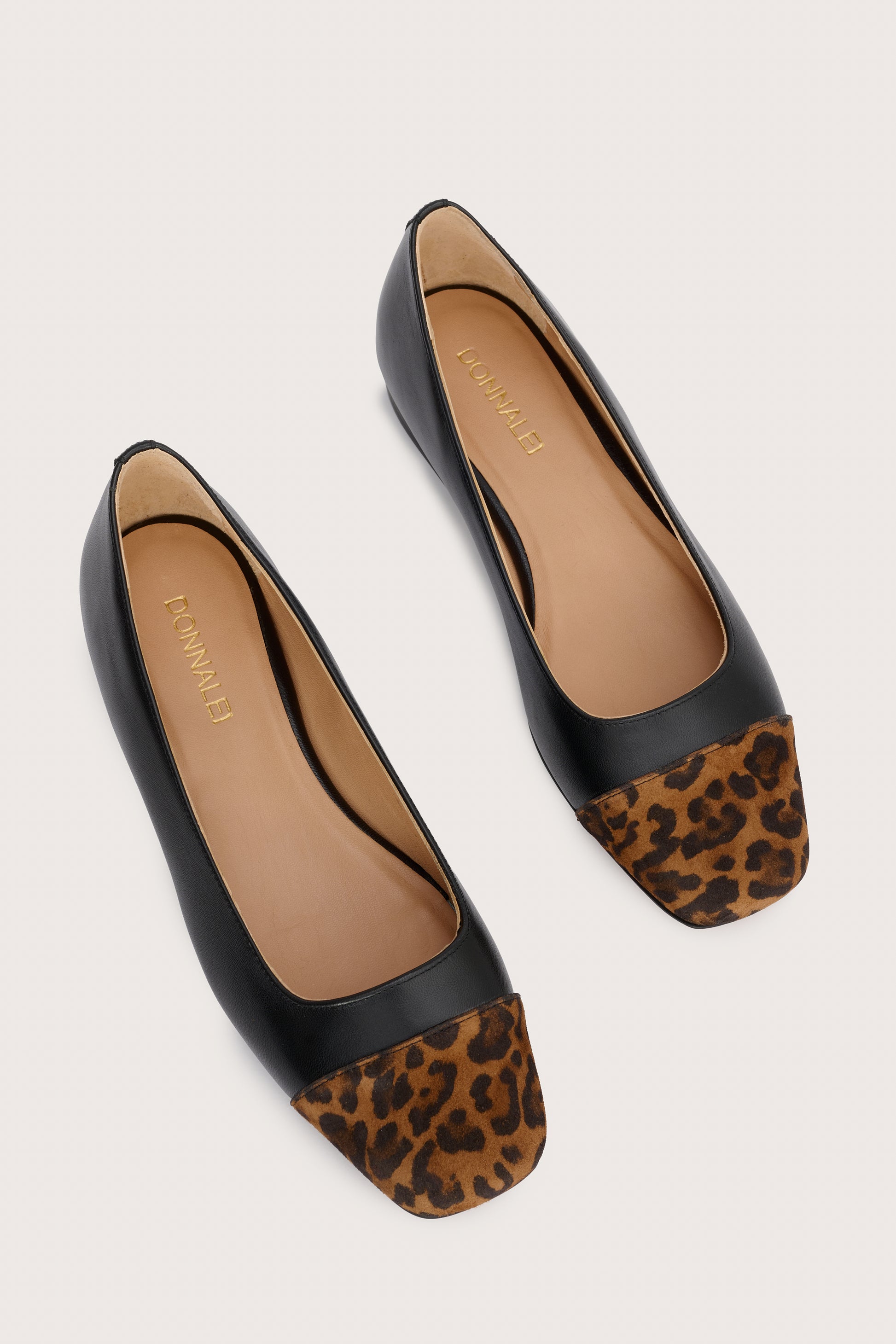 black leather pumps with animal print suede toe cap  birds eye view