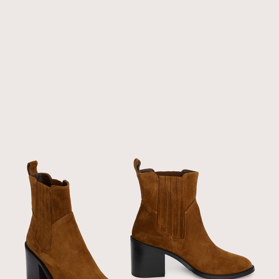 tan suede ankle boot with chunky black heel and elasticated tabs either side  side view