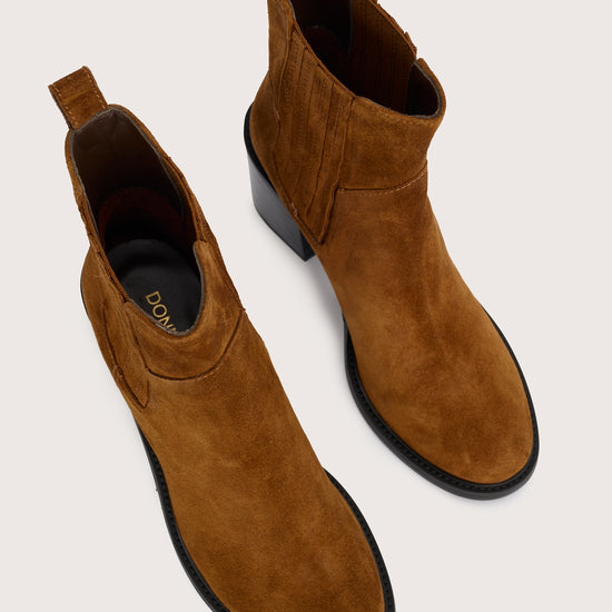 tan suede ankle boot with chunky black heel and elasticated tabs either side  birds eye view