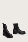 chunky black ankle boots with elasticated panels on side and red/green stripe on the front side view