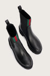 chunky black ankle boots with elasticated panels on side and red/green stripe on the front birds eye view