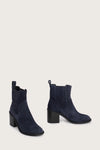 navy blue suede ankle boots with chunky black heel and elasticated tabs either side side view 