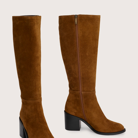 tan suede knee high boots with chunky mid black heel side view 