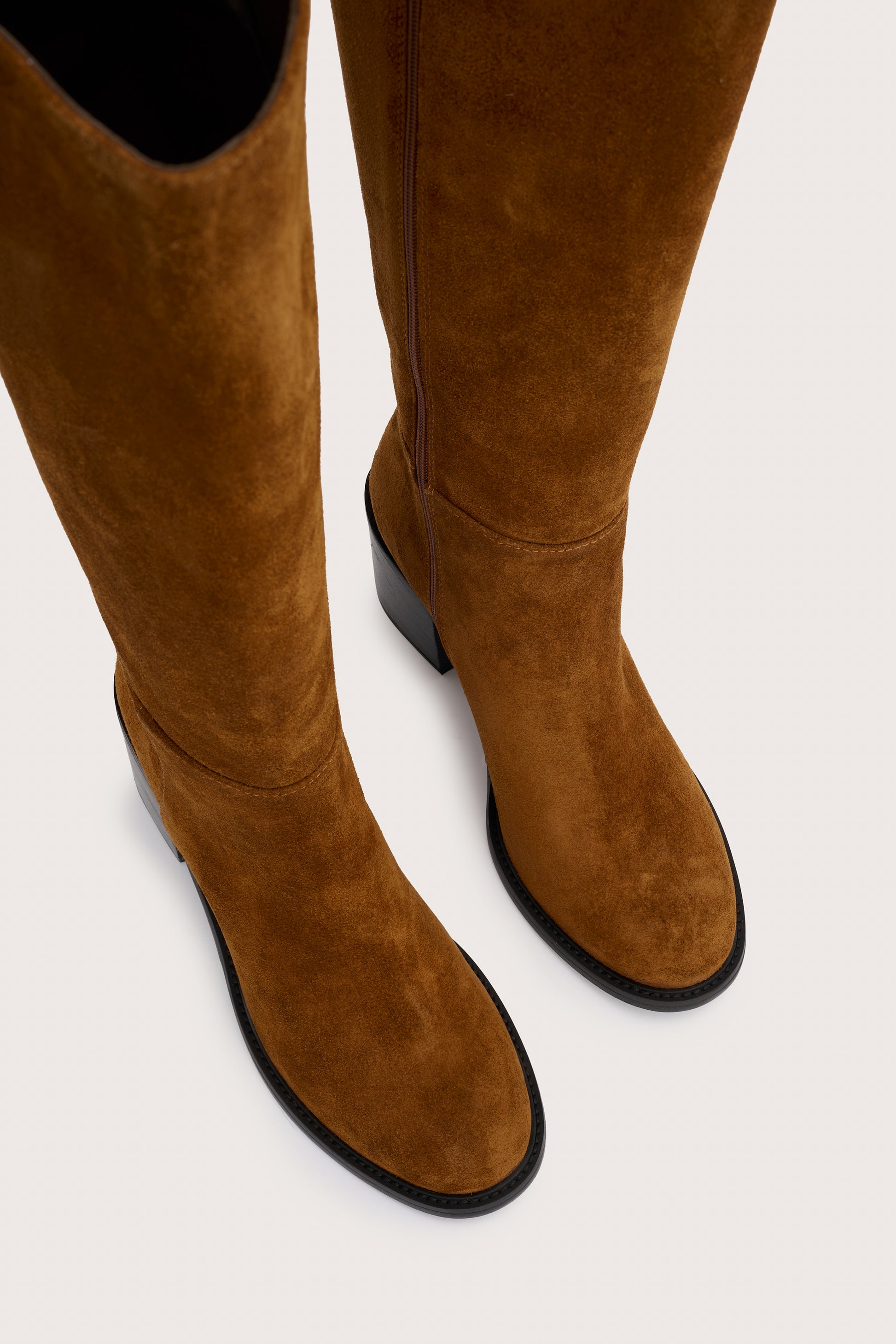 tan suede knee high boots with chunky mid black heel birds eye view 