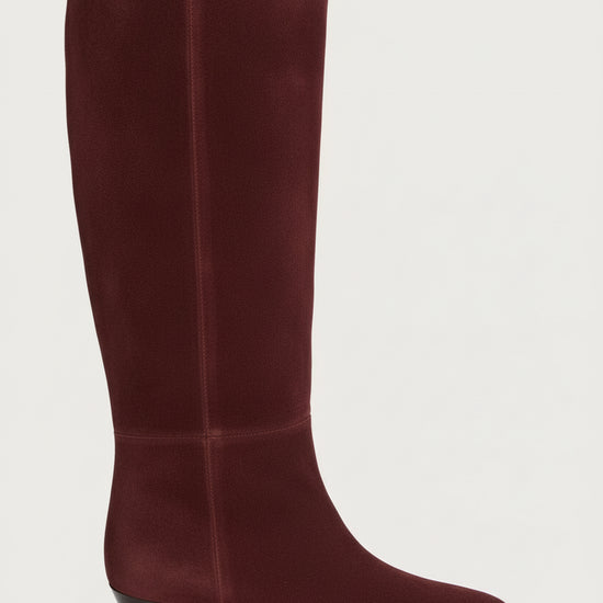 Maroon suede knee-high boot on a white background