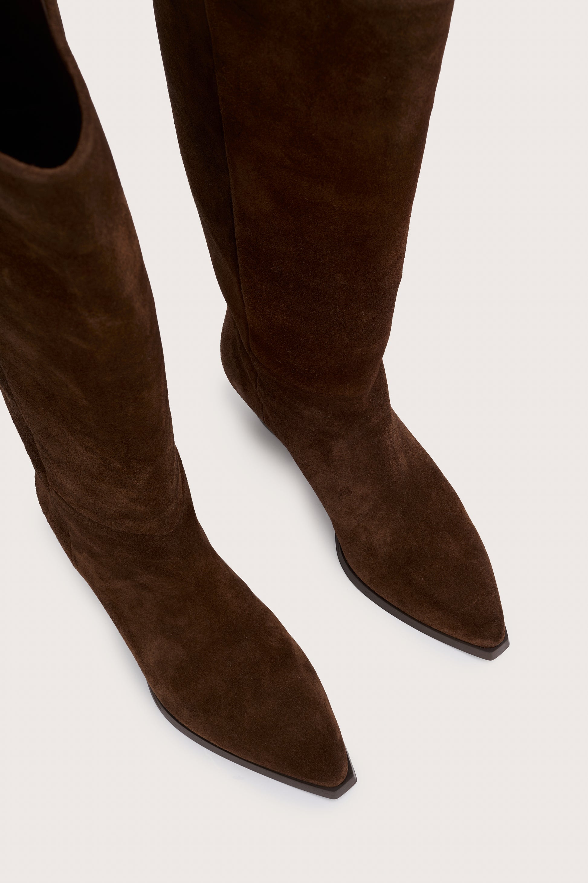 chocolate brown suede cowboy boots with black heel birds eye view
