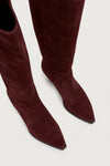Bordeaux suede knee-high boots on a white background