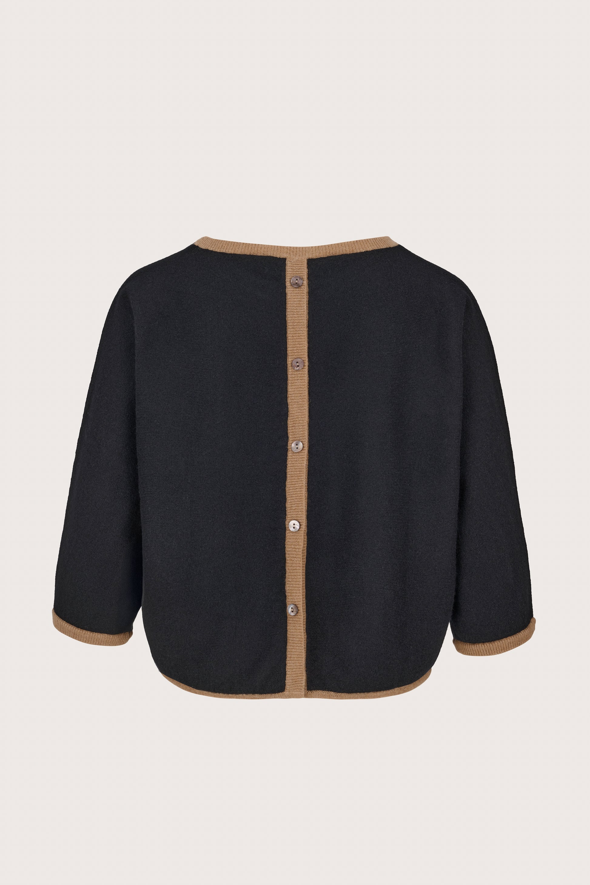 black crew neck cashmere boxy jumper with brown edging and button detailing at the rear rear view