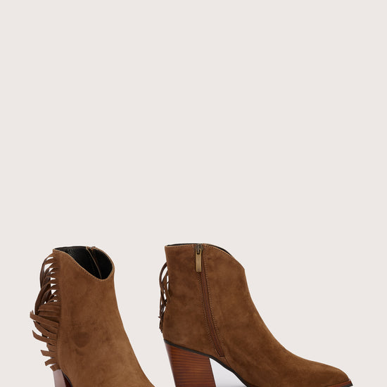 tan suede western heeled ankle boot with fringe detailing and chunky heel from donna lei front view