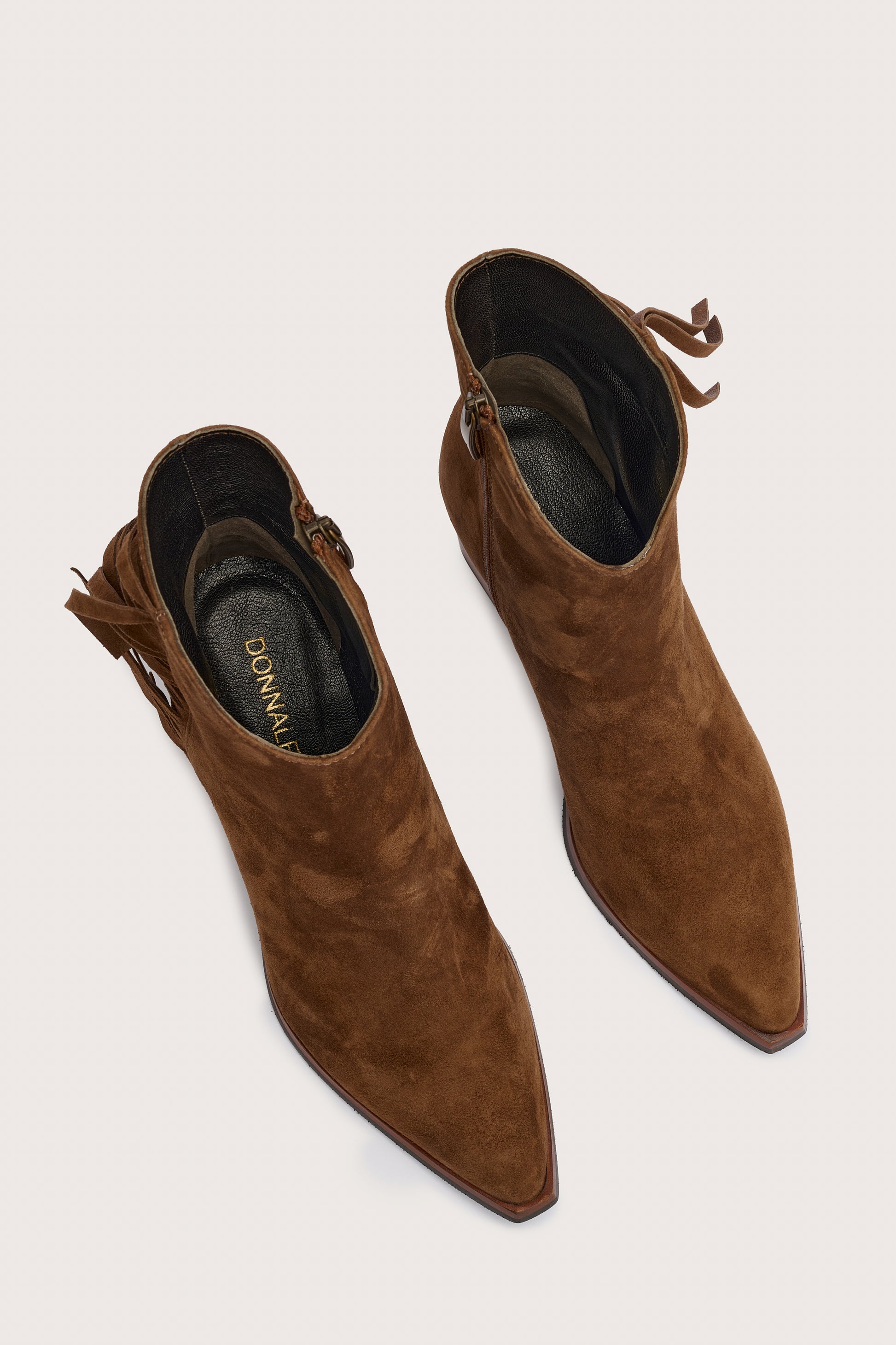 tan suede western heeled ankle boot with fringe detailing and chunky heel from donna lei birds eye view