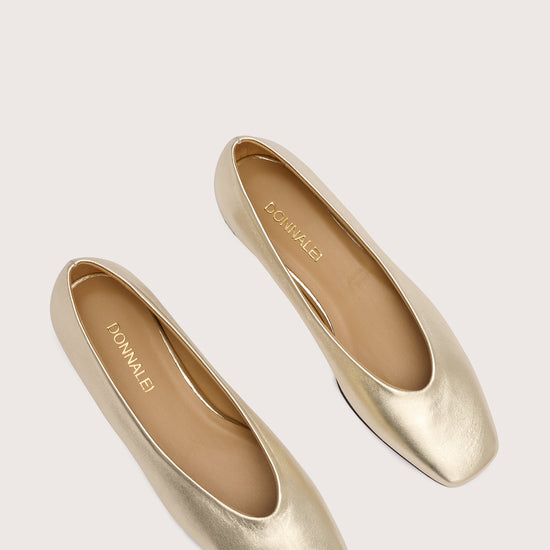 pale gold leather ballet flats with v shaped toe shape birds eye view