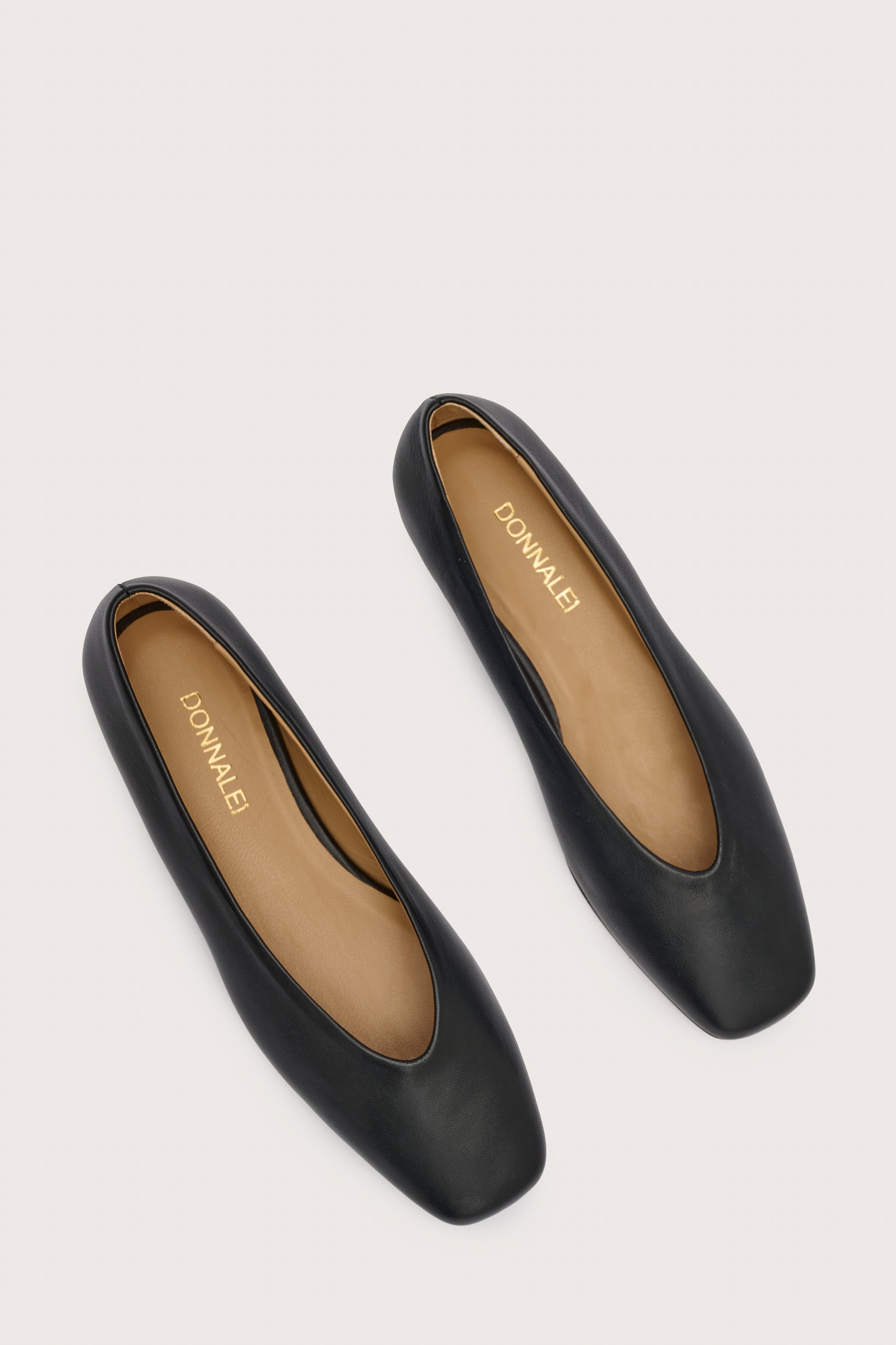 Black leather ballet flats with squared toe and v shaped toe shape from donna lei  birds eye view