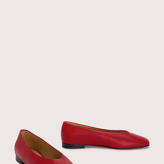 red leather ballet flats with v shaped toe shape front view
