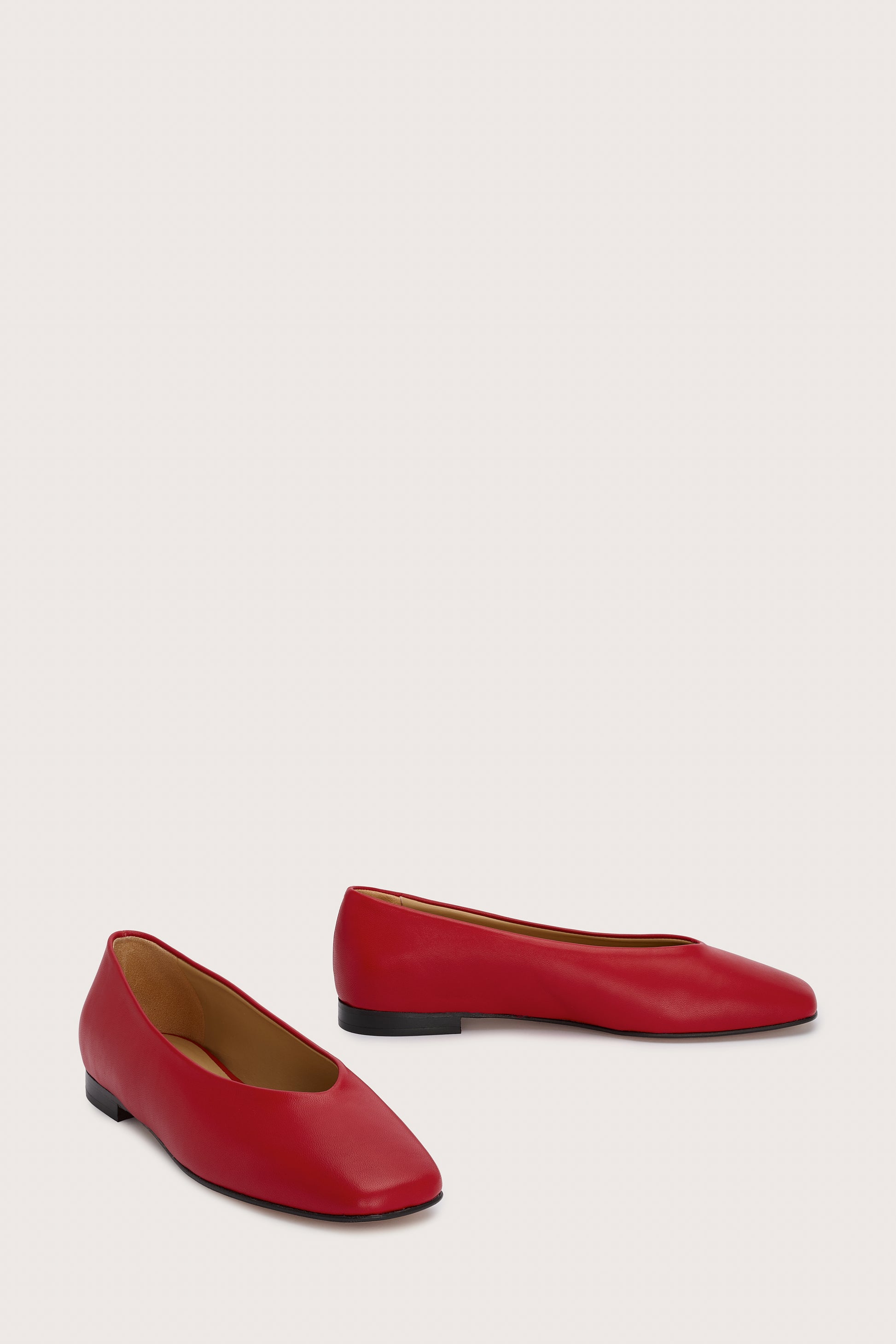 red leather ballet flats with v shaped toe shape front view