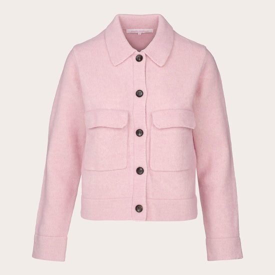 A light pink cropped jacket with a pointed collar, front button closure, and two flap pockets, shown on a plain light beige background.
