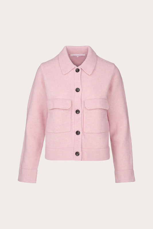 A light pink cropped jacket with a pointed collar, front button closure, and two flap pockets, shown on a plain light beige background.