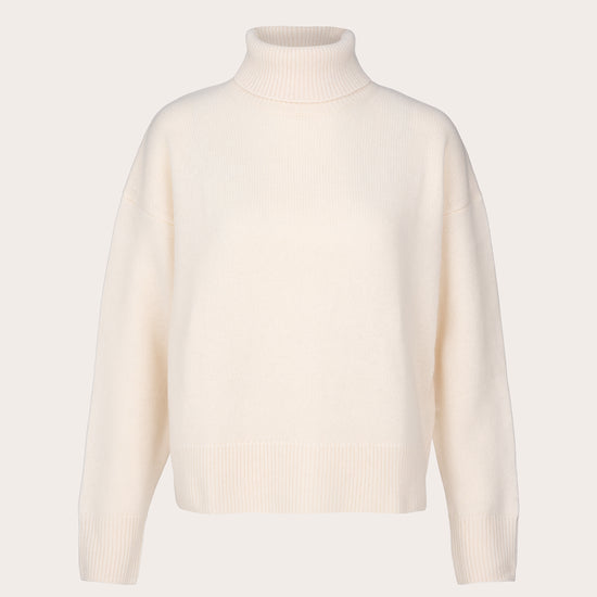 A cream-colored knit turtleneck sweater displayed on a clean, solid, very light beige background.
