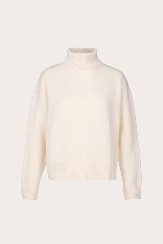A cream-colored knit turtleneck sweater displayed on a clean, solid, very light beige background.