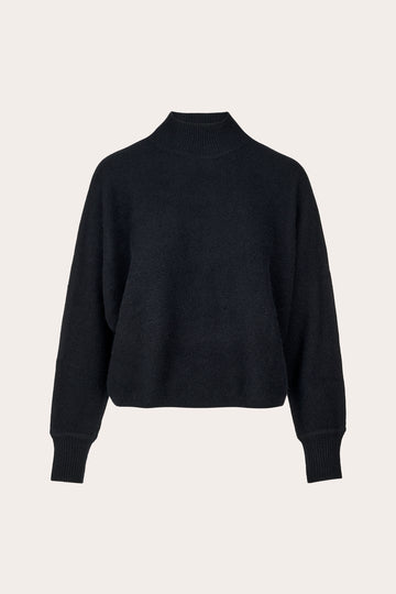 A black cropped mock-neck knit sweater with long sleeves and ribbed cuffs, displayed on a clean, light beige background.