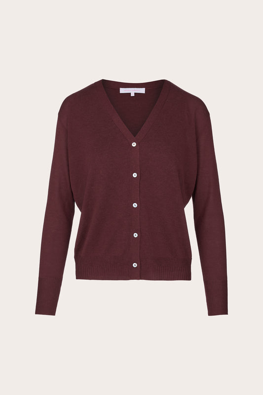 A burgundy knit cardigan sweater with a V-neck, long sleeves, and a button-up front, displayed on a neutral light beige background.