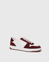 white trainers with burgundy suede side view 