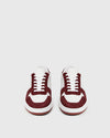 white trainers with burgundy suede  front view 