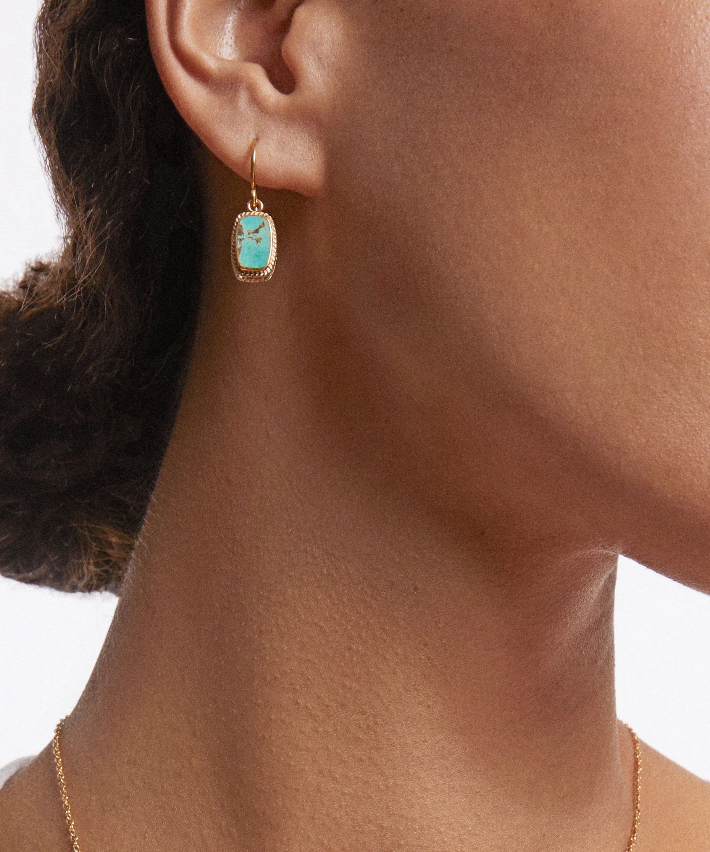 Gold plated drop earrings with oblong turquoise inset stone