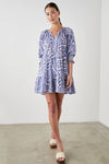 Short double tiered pull on dress with three quarter length raglan sleeves with ruching and ruffle cuffs notch neckline