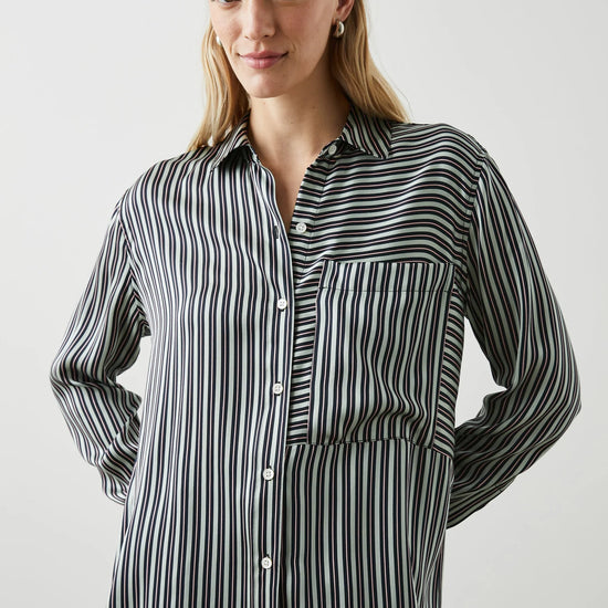 Green black and pink vertical striped silk shirt with large front patch pocket and full length plastic button fastening