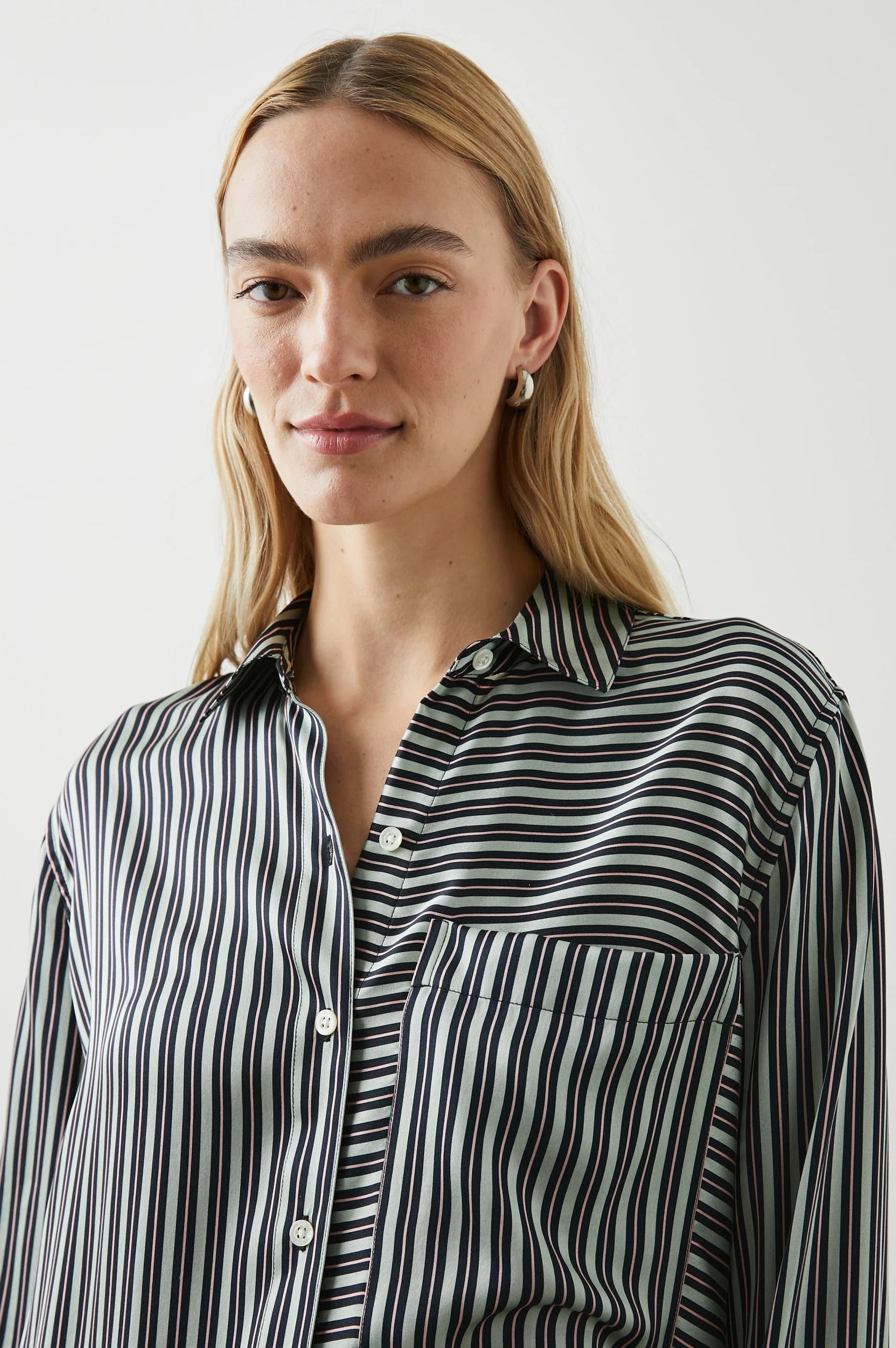 Green black and pink vertical striped silk shirt with large front patch pocket and full length plastic button fastening