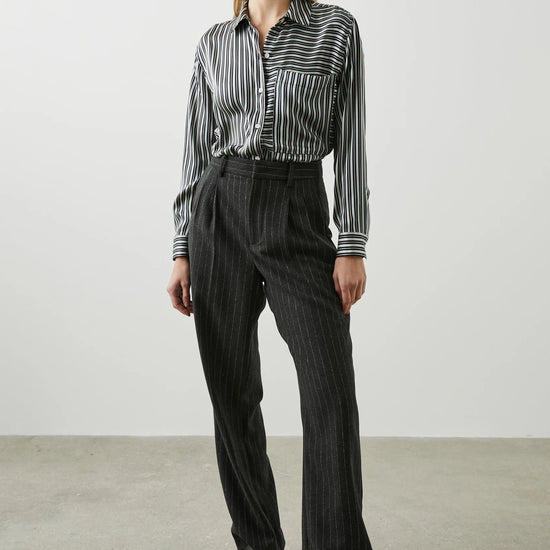 Green black and pink vertical striped silk shirt with large front patch pocket and full length plastic button fastening