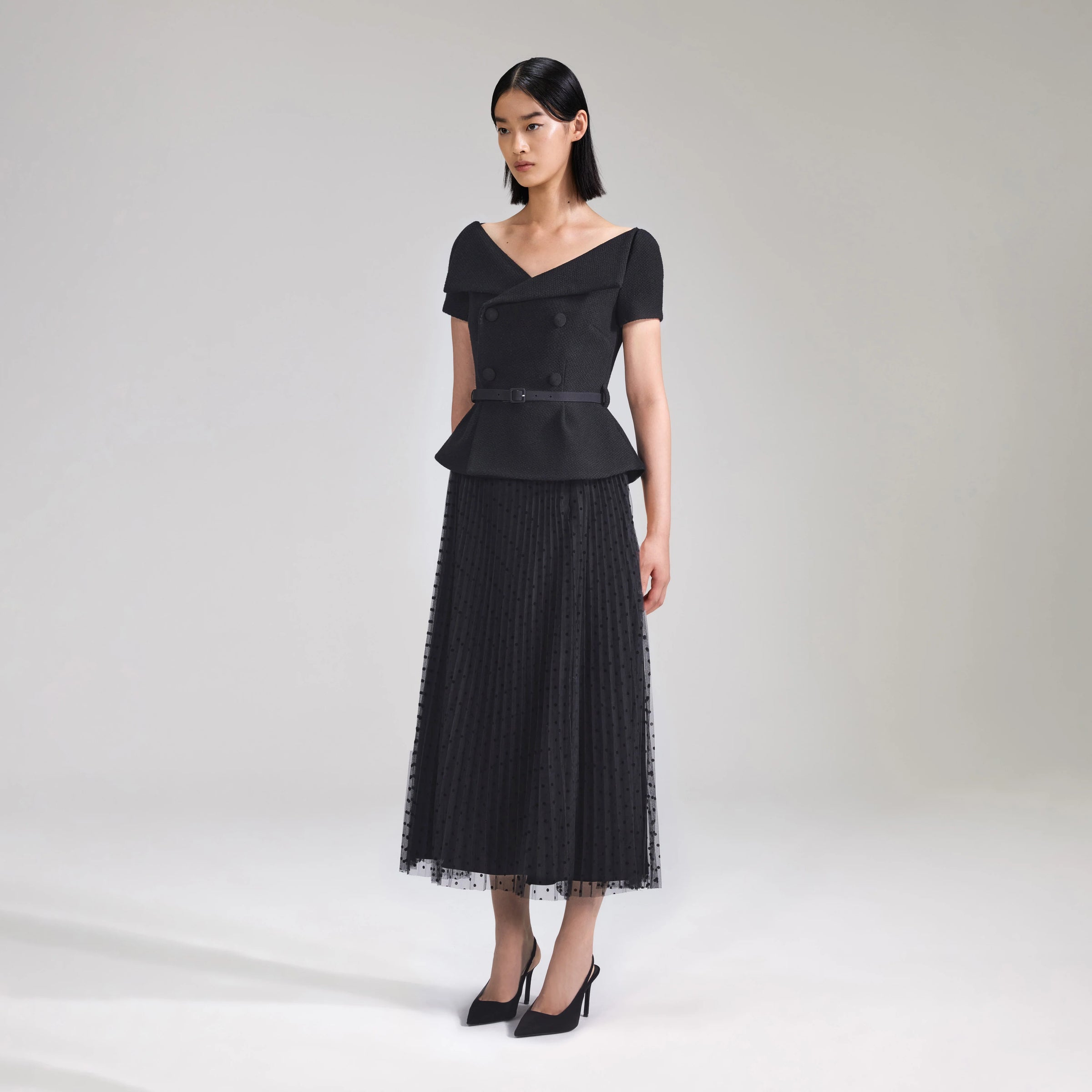 Black off the shoulder boucle jacket with pleated net back skirt