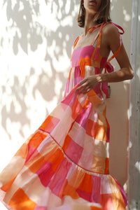 Pink and orange check linen maxi dress with three tiers fitted bodice and spaghetti straps an open back with thick tie fastening mid back