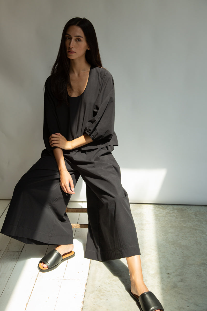 Black co-ord outfit worn with black leather sliders